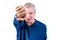 An elderly man demonstrates fist fight. Isolated on a white background