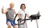 Elderly man on an exercise bike making a thumb up sign with an e