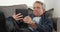 Elderly man falls asleep with tablet