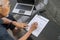 Elderly man filling a vehicle insurance form