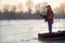 Elderly man fishing in the winter