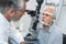 Elderly man with glaucoma at optician for optical examination