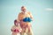 Elderly man hitting punching bag. Boxing. I love boxing. Portrait of a determined senior boxer with little boy child