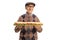Elderly man holding a tasty long sandwich in a baguette and smiling at camera