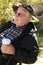 Elderly man holds coffee cup