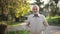 Elderly man in jacket. Old bearded man walking in autumn park