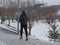An elderly man jogging in the park in winter, health benefits of running
