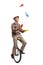 Elderly man juggling on a unicycle