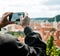 Elderly man is making pictures of city views