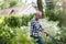 Elderly man mowing the lawn