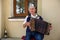 An elderly man playing the russian accordion