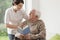 Elderly man reading book