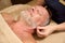 Elderly man receives a wellness relaxing massage