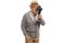 Elderly man recording with a vintage 8 mm camera