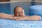 Elderly man relaxing in spa smiling