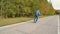 An elderly man rides a scooter in a Park for the first time in his life. Active lifestyle for the elderly.