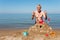 Elderly man with sand castle