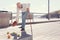 Elderly man scattering fruit from bag on the ground