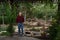 Elderly man standing in his garden