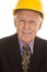 Elderly man suit hardhat close smile