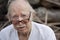 Elderly man in t-shirt and glasses