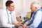 Elderly man talking with an American doctor