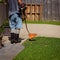 Elderly Man Trimming Lawn Edges