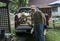 Elderly Man Unloading Firewood