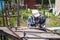 Elderly man welding metal construction