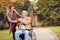 Elderly man in wheelchair with her daughter enjoying to visit to