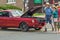 Elderly man and woman at classic vintage car show in USA