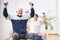 Elderly man and woman exercising on gymnastic balls during physiotherapy session at hospital