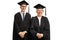 Elderly man and woman wearing a graduation gown and smiling