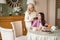 Elderly mother tucks the hair of her brunette daughter. Family concept