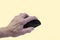 Elderly old senior hand holding wireless mouse learning computer internet