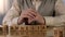 Elderly pensioner making word amnesia of wooden cubes on table, health care