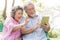 Elderly people lifestyles and communication technology. Happy grandparent using tablet video call and talking with family