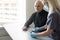 Elderly people measuring their pulse with their fingertips at a long-term care facility