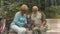 Elderly people with the tablet in the park