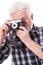 Elderly photographer with retro camera