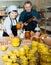 Elderly potters among their products