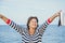 Elderly pretty woman enjoys relaxing by the sea