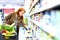 elderly pretty woman shopping for fresh healthy food in the supermarket