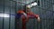 Elderly prisoner in orange uniform holds hands on metal bars in jail