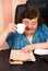 Elderly reading news and drink cup of coffee