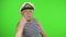 Elderly sailor man is angry and shows a fist. Sailorman on chroma key background