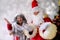 Elderly santa claus with his wife congratulates children and adults, shows with hands, concept of christmas, childhood, festive