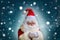 Elderly santa claus in a suit, with a white beard congratulates children and adults, shows with his hands, the concept of