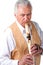 Elderly senior male playing native american flute