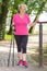 Elderly senior woman practicing nordic walking, sporty lifestyles in old age